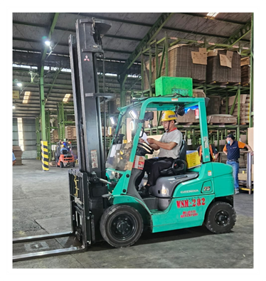 Certified forklift driver handling warehouse operations